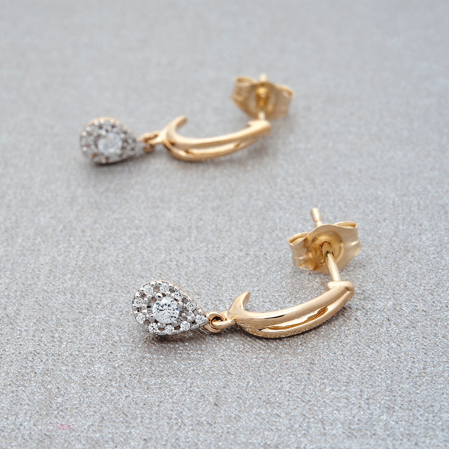 Edan Diamond Pear Dangle Earrings Placed on Cloth