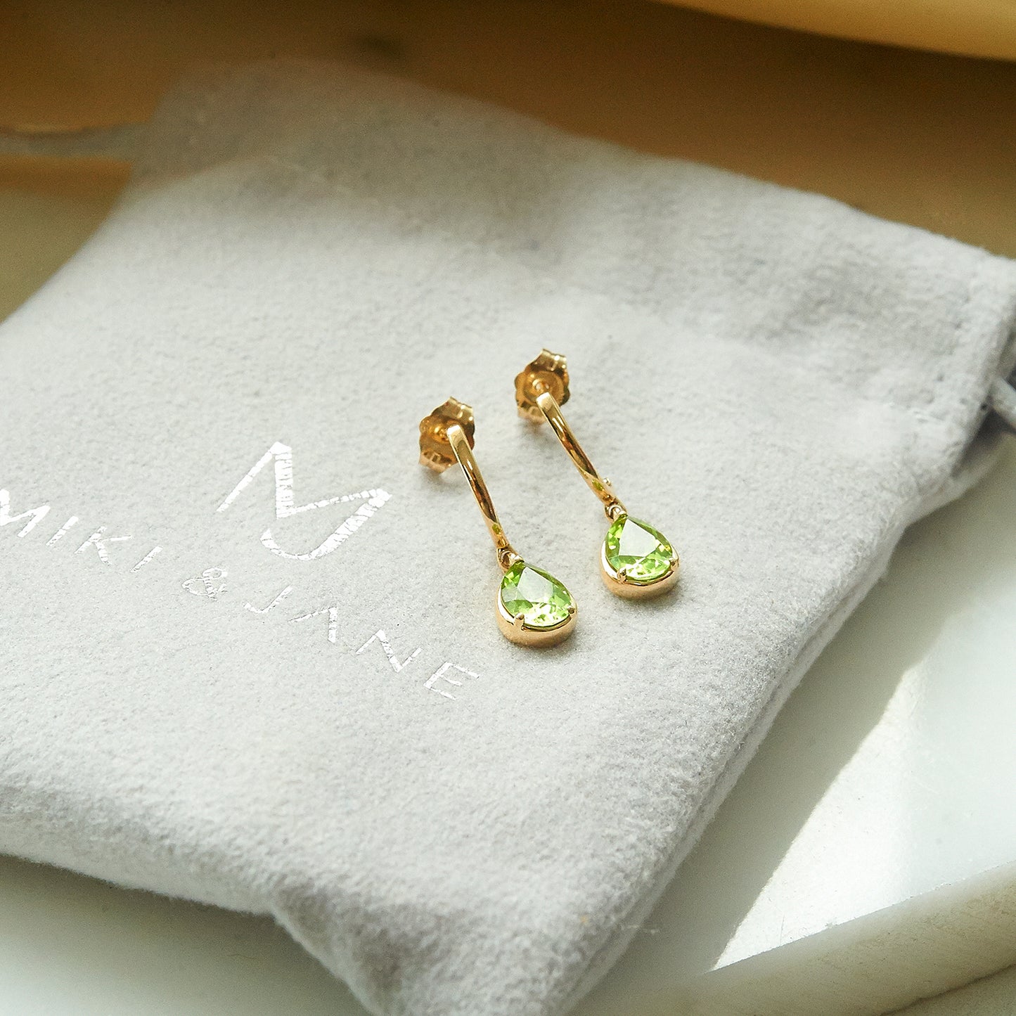 Peridot Pear Dangle Earrings in Yellow Gold