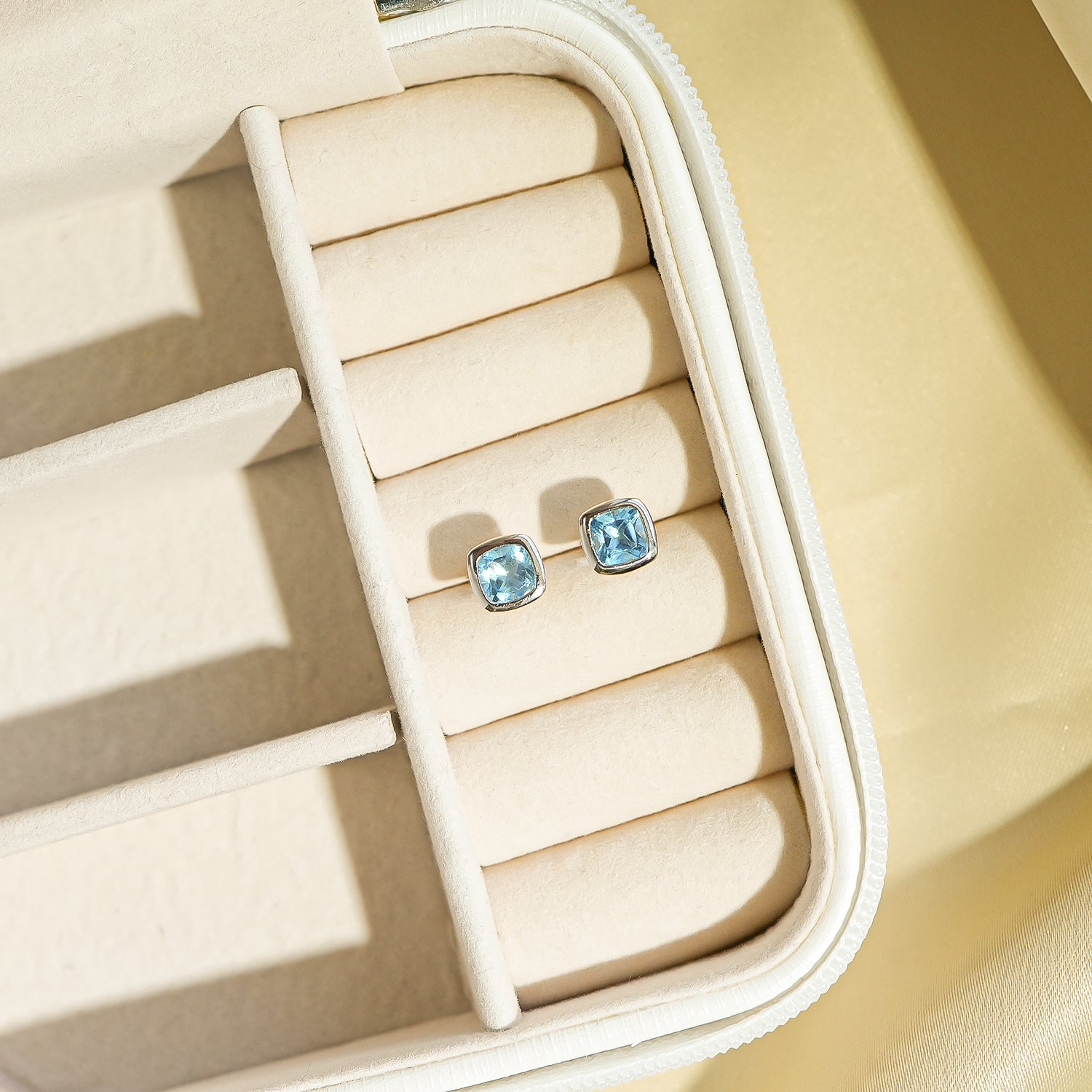 Blue Topaz Cushion Stud Earrings are in box