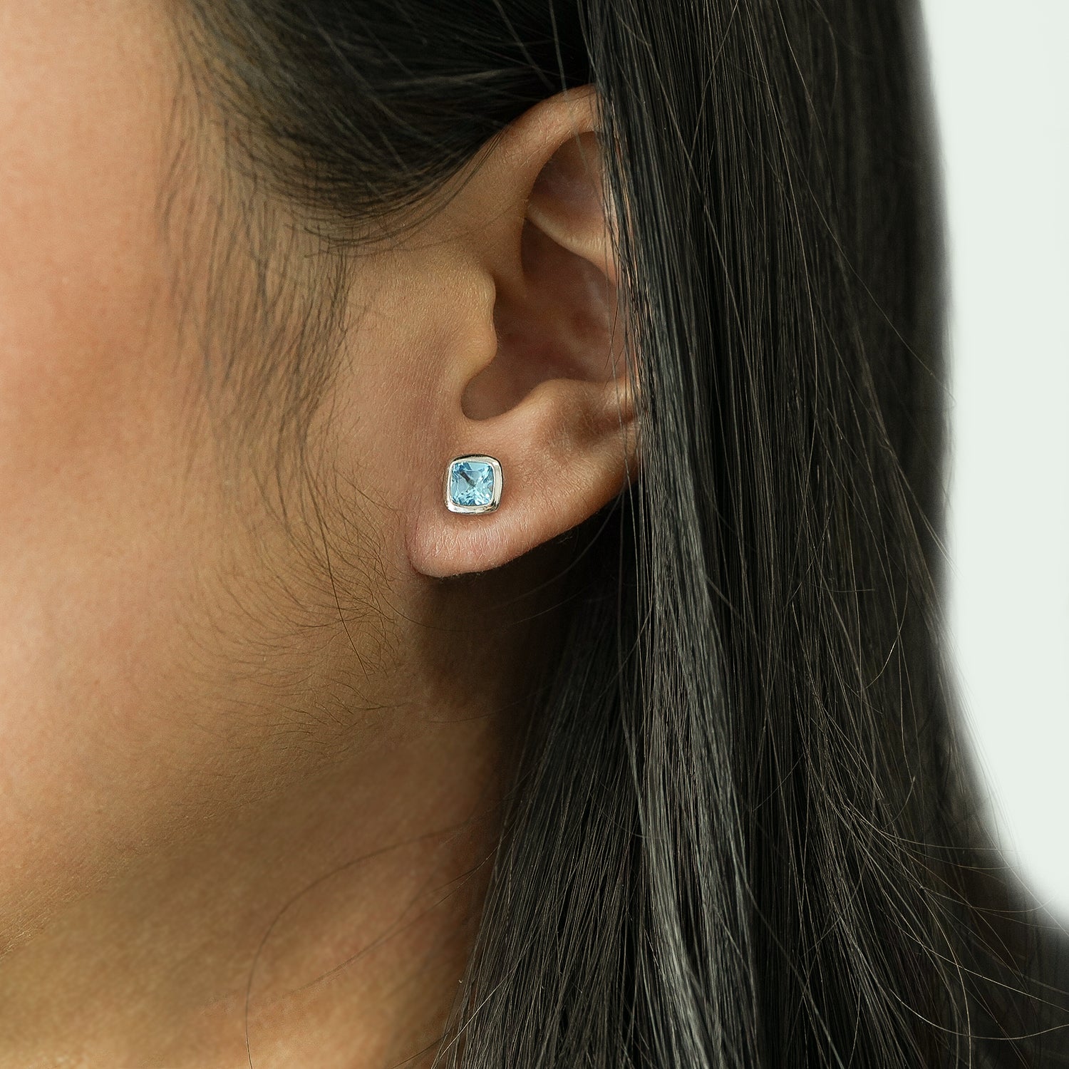 Blue Topaz Cushion Stud Earrings in Women's Ear