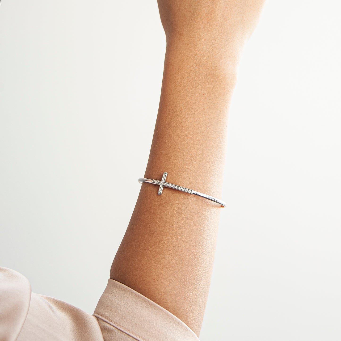 Bruna Diamond Cross Bangle Bracelet In Lady's Right Hand