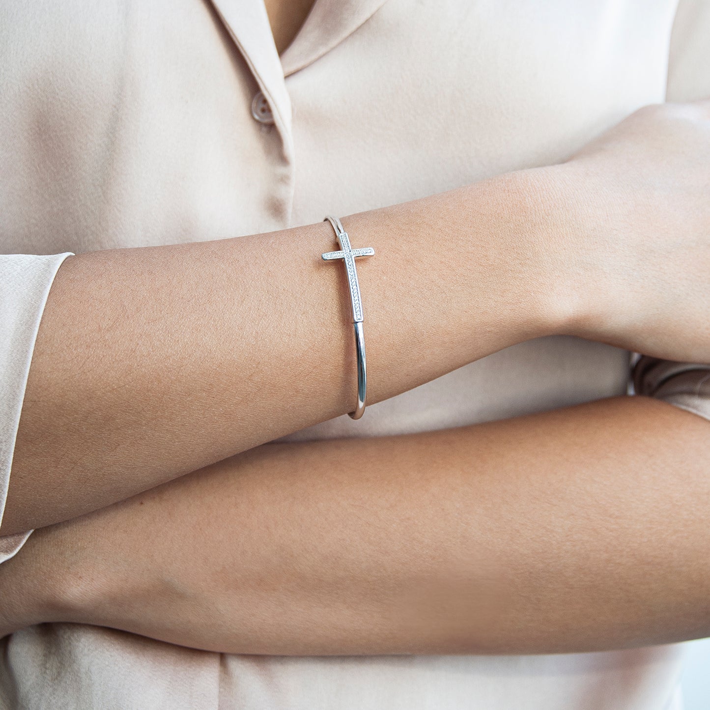 Bruna Diamond Cross Bangle Bracelet In Lady's Hand