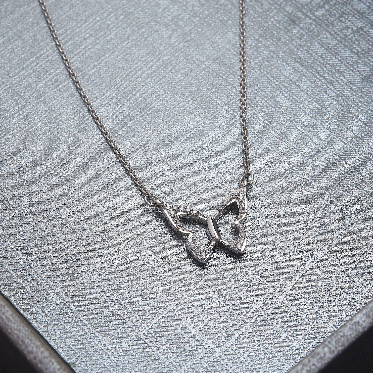 Farfalla Butterfly Diamond Necklace Placed On Cloth