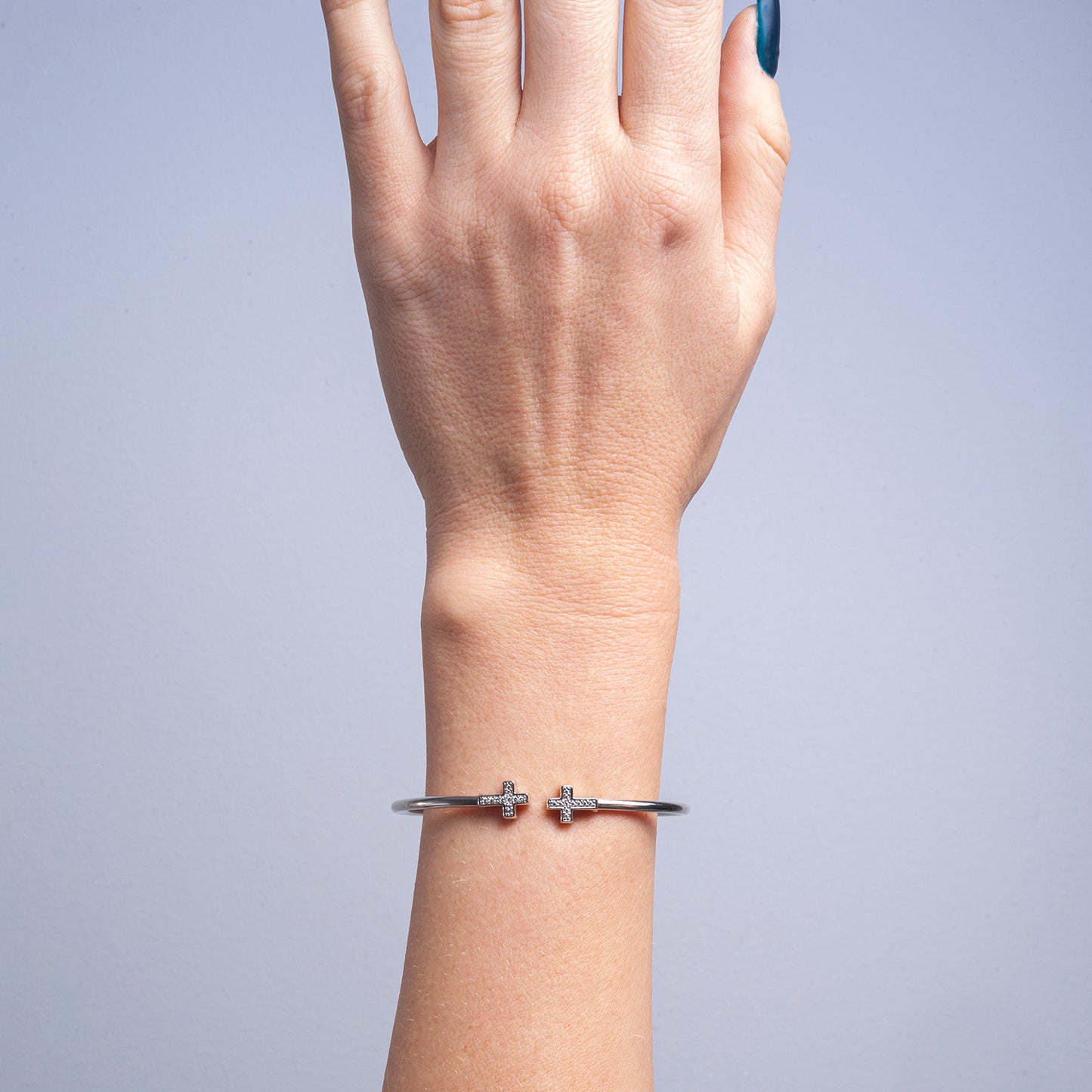 Brandi Open Diamond Cross Bangle Bracelet in Lady's Hand