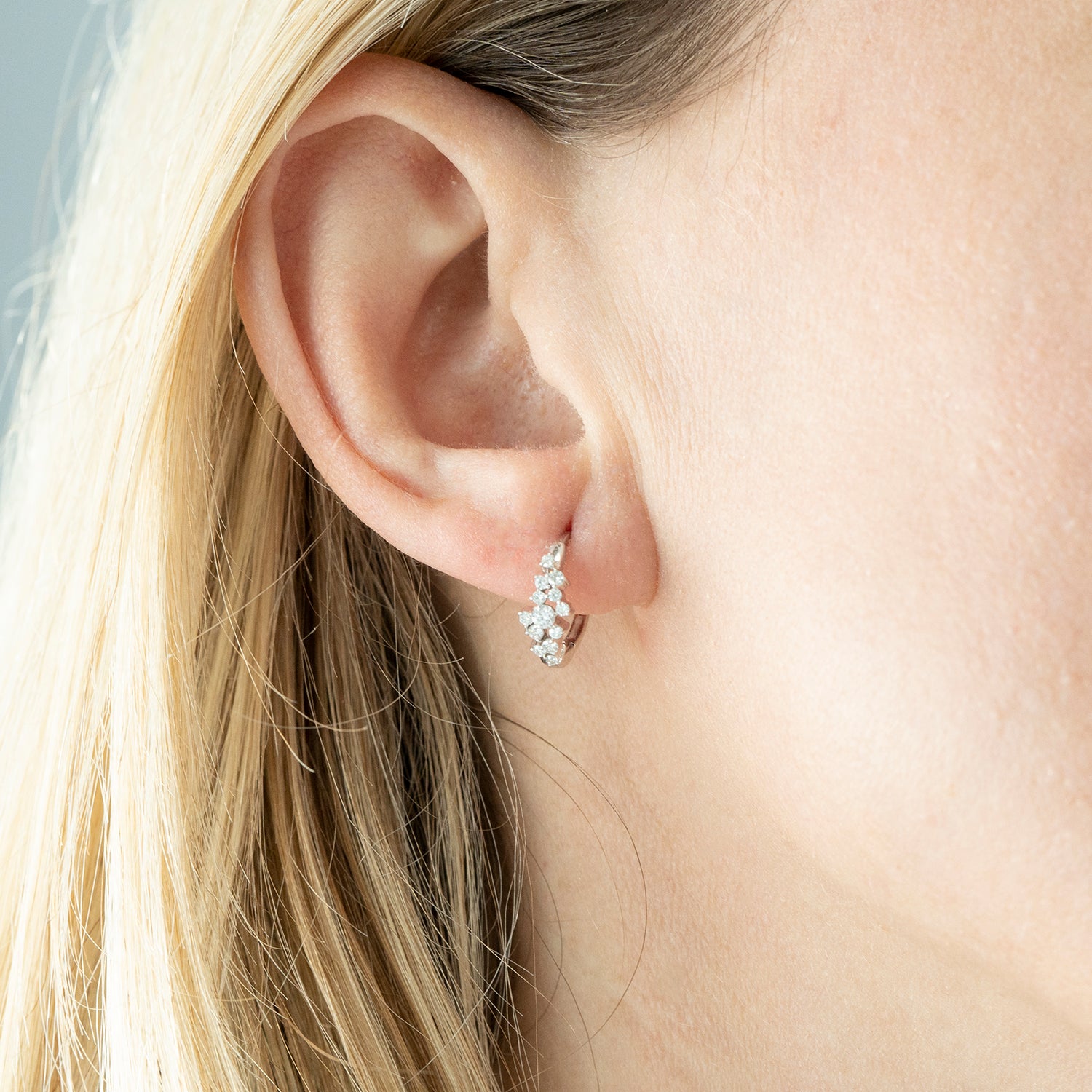 Harlow Scattered Diamond Huggie Hoop Earrings In Girl Ear