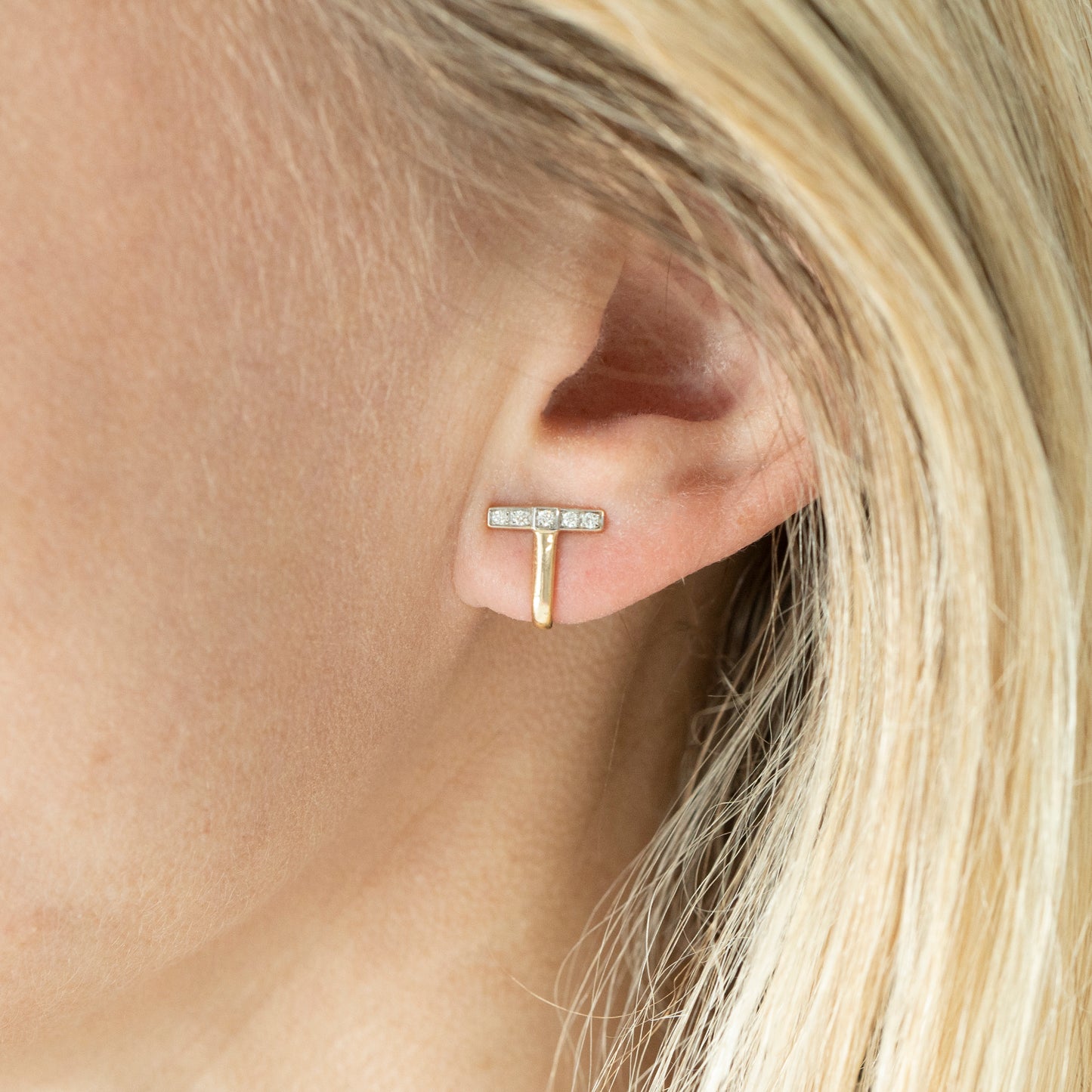 Ember Curved T Diamond Huggie Earrings In Ear
