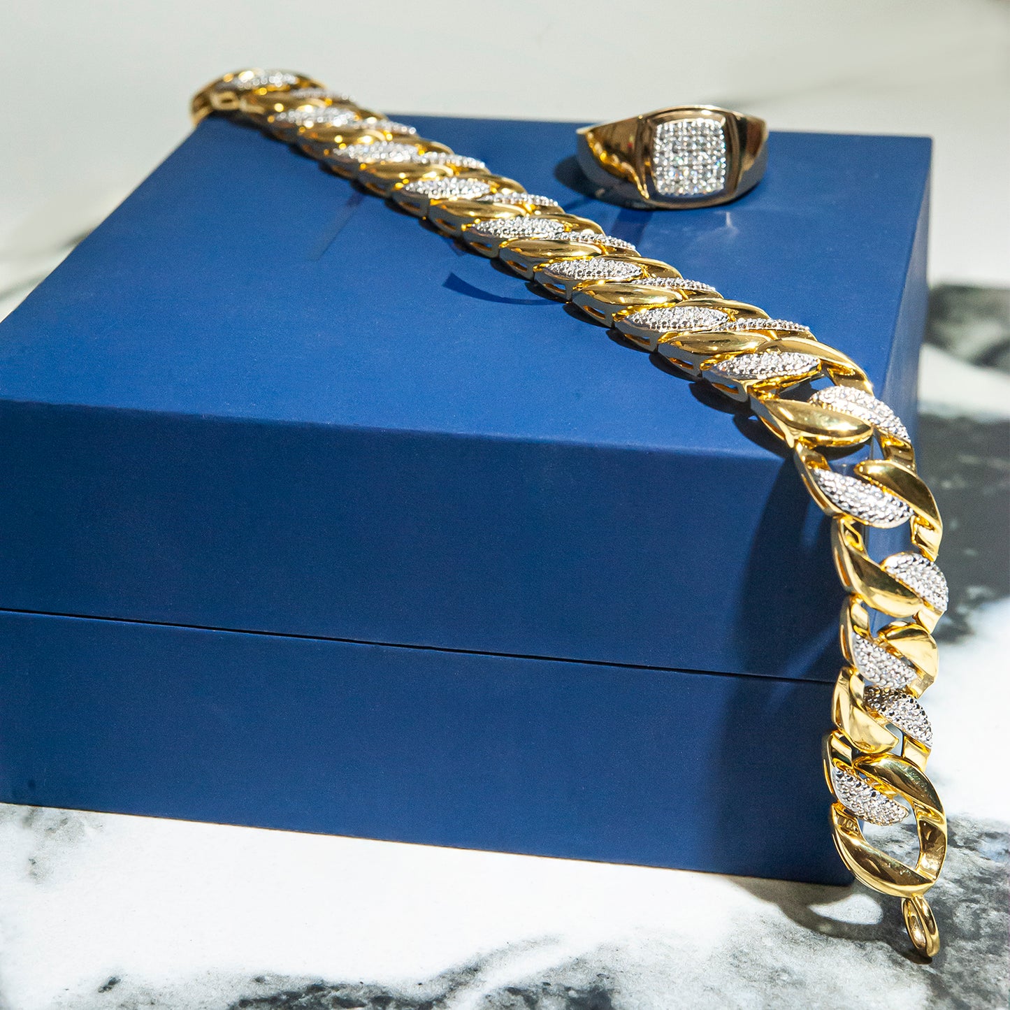 Diamond Link Bracelet Placed on Box With Ring