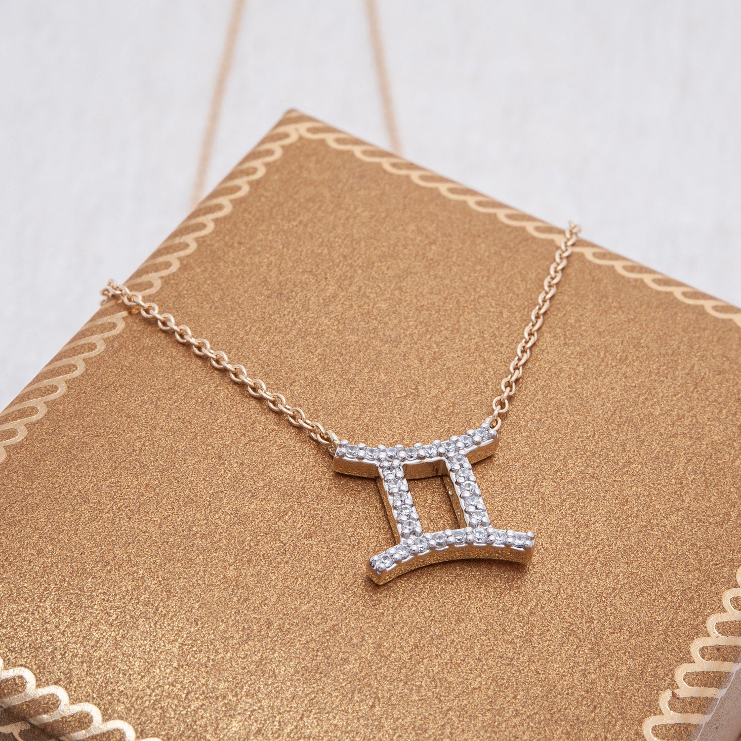 Gemini Zodiac Diamond Necklace Placed on Box