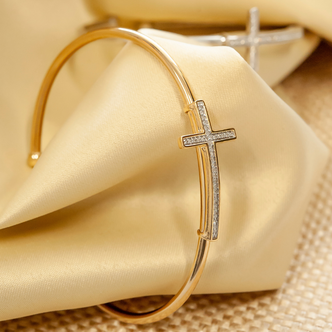 Bruna Diamond Cross Bangle Bracelet Placed on Cover