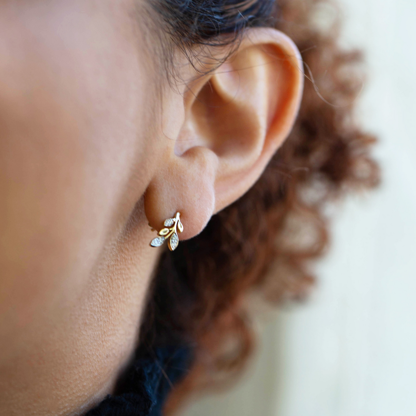 Desi Diamond Leaf Stud Earrings On Lady's Ear
